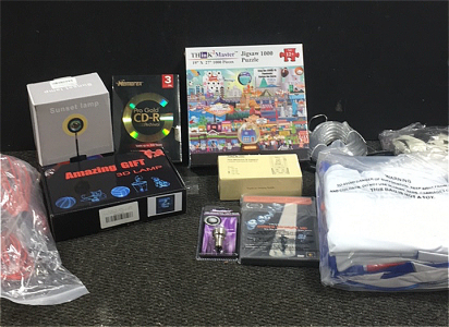 (1) Decorative Sunset Lamp (1) Godzilla 3D Lamp (3) Memorex Pro Gold Cd-R Discs (1) Tacklife Laser Distance Meter (1) Streetglow LED twilight (1) Bag Zof Inflatable Pool Toys (2) LED Solar String Light Set