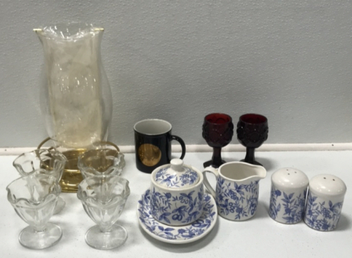 (1) Hurricane Lamp (4) Glass Sundae Cups (2) Glass Mini Goblets (1) 5-piece Matching Cream, Sugar, Salt and Pepper Set (1) American Embassy-Paris Mug
