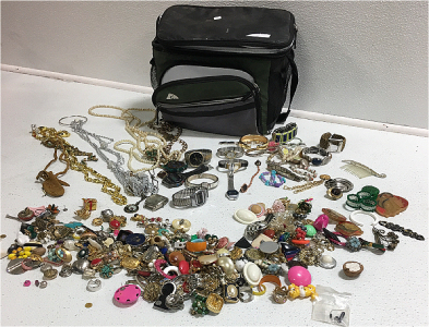 Lunch pail full of costume jewelry