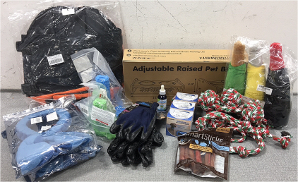 Raised Pet Bowl Stand, Variety of Chew Toys, (3) “No Bark” Collars, Peanut Butter Treats, Hemp Oil, (2) Pair of Grooming Gloves, Lg Life Jacket