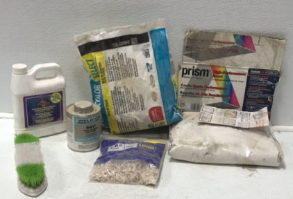 (1) Unused Bag Prism High-performance Grout in Alabaster (1) Partial Bag Permacolor Grout Base (1) 1-pint Weld On Vinyl Shower Pan Liner (1) Partial Bottle Piranha Wallpaper and Paste Remover (1) Scrub Brush (1) 1000-pack Tile Spacers