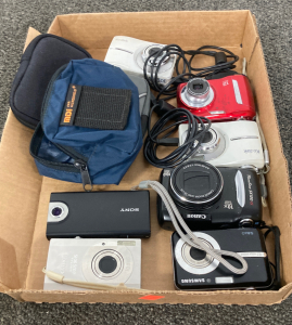 Box of assorted cameras