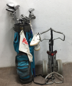 Golf clubs and bag with golf bag carrier and shoes