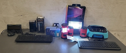 Box of (3) Keyboards, (3) Solar Powered/Battery Powered Lanterns, (2) Brand New WiFi Extenders, Clarity Bed Shaker Alarm Clock and More