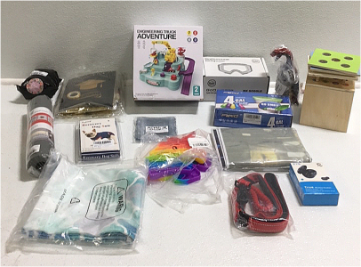 (1) Engineering Truck Adventure Toy (1) Wooden Box Toy (150) 4-Gallon Trash bags (1) Pair Of E7s True Wireless Headset (1) Dig Leash (1) Recovery Dog Suit Size Small (1) GoOutdoor Anti Fog Goggles (1) Allosaurus toy Dinosaur and More Household items