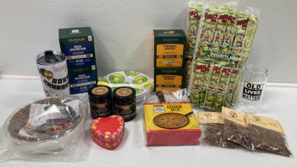 (2) Turmeric Pepper Tea, (2) Oolong Tea, (2) Corn Snack, (3) Sanguinaria Blood Root Tea, Retirement Cup, “Old Lives Matter” Glass, Cast Iron and Cookie Mix, (2) Assorted Heart Tin Chocolates, Air Fryer Parchment, Kiwi Melamine Salad Plates, (2) Fruit Spre