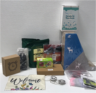 (1) Cat Scratch Post (1) Portable Pet Water Bottle (1) Retro Alarm Clock (1) Small Pet Harness (1) Windmill Cat Toy (1) 2-pack Thermal Insulated Socks