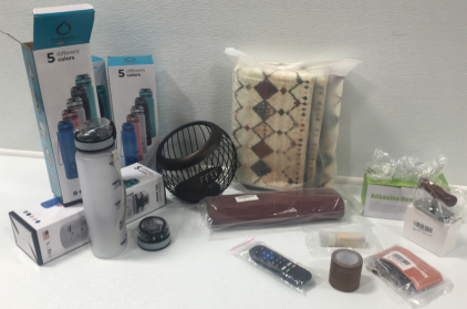 (4) Water Bottles, Coffee Pod Holder, Area Rug, Place Mats, Adhesive Hooks, Jar Opener, Decorative Tape, Roku Remote, Buckle Adjusters