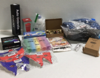 (1) Yotruth Pet Bed (1) Pet Grooming Brush (1) Laser Cat Toy (1) Matilor Size Small Dog Harness (150) 2.6 gallon Trash Bags (5) Cvndkn Pop Tubes toys (1) RGB 65&rsquo; LED Strip Light (40) 4th Of July Masks (1) Sosunny Auto Umbrella SP4
