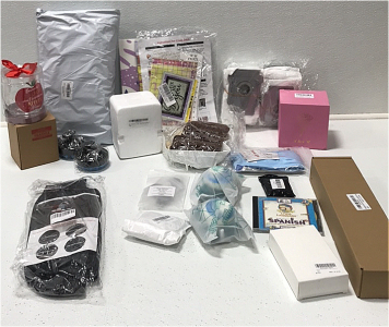 (1) Spa Bathtub Pillow (2) Novelty Wine Glasses (1) Novelty Coffee Mug (2) Scalp Scrubber (1) Wall Mounted Coat Rack (1) Car Accessory Pocket (2) Collapsible Water Bottle and More SP2