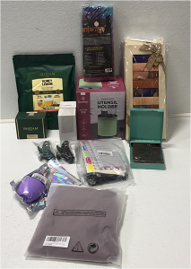 (1) Stainless Steel Utensil Holder (2) Variety Pack of Hot Chocolate (1) 100-Tea Bags of Honey Lemon Green Tea (1) Pure Black Tea (1) Sun and Moon Rainbow Tapestry (1) Margaritaville Passport Holder (1) Ice Roller (3) 2-pcs Large Claw Hair Clips (1) Women