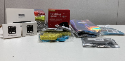 (2) Packs of 2 Black Air Tag Cases, (2) Id Bag Holders, (1) Mug Warmer, (1) Uneam Holiday Light Clips and more SP1