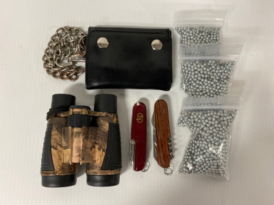 (3) Small bags of BBs, (2) Swiss Army Knives, Binoculars and Wallet