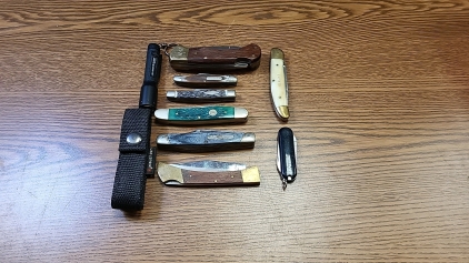 Assortment of (8) Folding Pocket Knives, Small Flashlight, and More