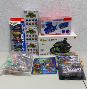 StuntCar Radio Controlled Hot Speed Racing 2.4 GHz Motorcycle, Deform Dinosaur, (3) Big Wheel Monster Zap Trucks, (1) 5 Piece Die Cast Car Set, (1) Tonka Activities To Go Set, (36) Pull Back Cars, (1) Teenage Mutant Ninja Turtle, (1) Set Of Two Minimates 