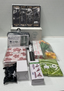 (1) EnerPlex Body Pillow (1) 52&rdquo;x84&rdquo; Blackout Curtain (1) Viking Wall Decor (1) Roll Of Leather Repair Tape (1) Cooking Paper (1) Zip Slicer (1) Hand Soap Dispenser (1) Large Chair Leg Covers (2) Vinyl Flannel Tablecloth and More Home Decor