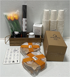 (1) Wooden Decor Box (1) Bunch of Faux Flowers (1) Hand Soap Dispenser (1) Large Chair Leg Covers (1) Leather Repair Tape (1) Therapeutic Bath Salt (2) Bamboo Serving Plates (1) Aquafit Water Bottle (1) Pack of Spice Jar Labels (1) Paper Cups