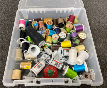 Container with Assorted Thread and Sewing Materials