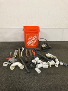 Assortment Of Tools And Pipe Parts