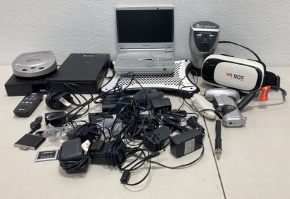 (1) Antec Laptop Cooler, (1) Toshiba Portable DVD Player, (1) External DVD Rewritable Drive, (1) Memorex Optifix Pro DVD Cleaner/Repair, (2) Roku Boxes, (1) Cobra Microport 200 Watts Power Inverter, (1) VR BOX Virtual Reality Glasses, Plus Lots Of Plugs A