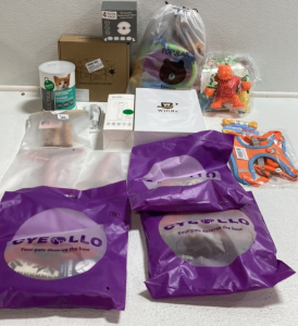 (1) Interactive Cat Puzzle Box (1) Premium Milk Replacer (1) Pet Fountain Replacement Filters (1) Professional Pet Grooming Slicker Brush (3) Lint and Pet Hair Removal Brush (3) Pet Sweaters (1) Neon Harness and Leash Set (1) Bag of Various Chew Toys and 