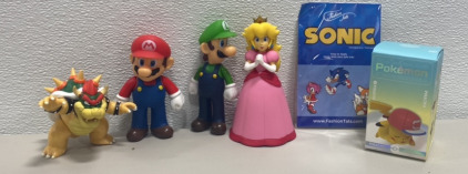 (1) Set of Mario Crew Figures, (1) Pack of Sonic The hedgehog Tattoos, (1) Pokémon Toy