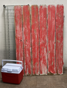 (1) Red Wooden Gate, (1) Metal Rack, (1) Small Red Cooler