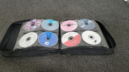 Binder of Assorted Music CD's