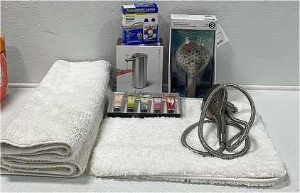 (2) Kohler Multifunction Hand Shower Head (1) Simple Human Sensor Pump Soap Dispenser (2) Shaggy Bath Mats (1) Plush Bath Mat (1) Boston Advance Contact Solution Kit (1) 5-pack Goat Milk Hand Cream