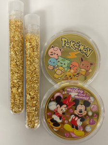 Pok&eacute;mon and Mickey Mouse Collectible Coins and 2 Jars of Gold Flake