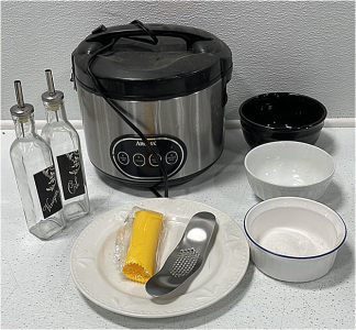 (1) Aroma Rice Cooker (1) Matching Set Oil & Venegar Bottles (1) Garlic Crusher (3) Various Ceramic Bowls (1) Ceramic Plate