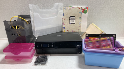 HP Envy 4500 Printer, (7) Plastic Storage Bins, Hard and Soft Pencil Cases, (2) Seasonal Letterhead, Craft Bottlecaps, Various Cords and Cables