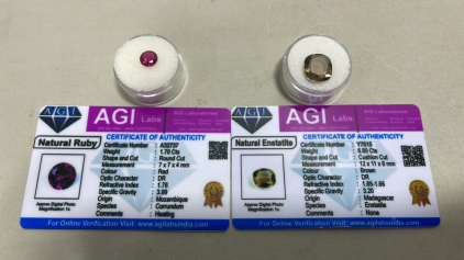 (1) Natural Red Ruby 1.70ct (1) Brown Enstatite Both W/ COA