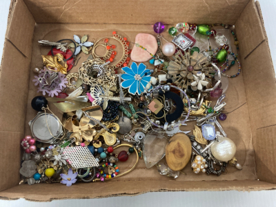 Flat of costume jewelry