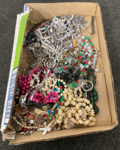 Flat of costume jewelry