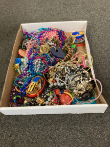 Flat of assorted costume jewelry