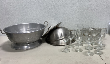 (1) Large Commercial Restaurant Metal Strainer, (3) Various Sized Pan Lids, (11) Various Sized Clear Glass Wine Glasses, (1) Large Hand-held Commercial Strainer