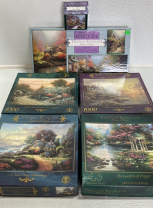 (3) 1000pc Thomas Kinkade Puzzles, (1) 500pc Kinkade Puzzle, (1) Set of 3 Kinkade Puzzles, (1) Mini 100pc Kinkade Puzzle