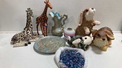 (2) Bunny Statues, Bunny Decor Planter, Blue and Gold Platter and Pitcher, Painted Vase, (2) Giraffe Statues, Decorative Stones