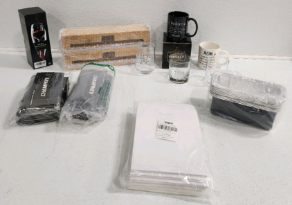 (4) Whiskey Glasses, (2) Mugs, (2) Golf Towels, Wrap Cutter, Magic Decanter, Grease Pan, Bakery Boxes