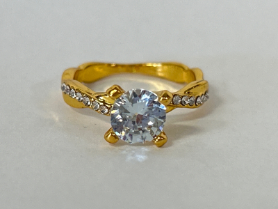 Gold Toned Ring With Clear Stone Size 6