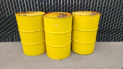 Three Yellow 55-Gallon Drums