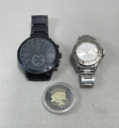 (1) Rolex Submariner Men’s Watch, (1) Large Black Men’s Watch, (1) United States Marine Corps Release The Dogs Of War Collectible Coin
