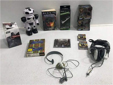 Star Wars Suckers, Storm Trooper Toy, Halo Book, Civilization PC Game, Medal Of Honor Gamd, (2) Dragons, (2) Star Wars Card Decks, (2) Gaming Head Phones