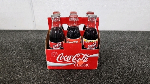 Vintage Six Pack Of Coca-Cola From Different Era's