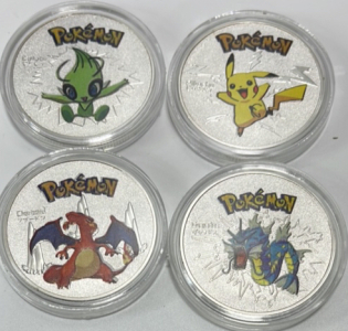 (4) Pok&eacute;mon Collectible Coins&hellip; Pikachu, Celebi, Charizard, Gyarados