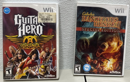 (1) Wii Guitar Hero AeroSmitch, (1) Wii Cabelas Dangerous Hunts 20