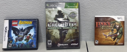 (1) Nintendo DS Guitar Hero In Lego Batman Case, (1) Call of Duty Modern Warfare Xbox 360 Game, (1) Links Crossbow Training Wii Game