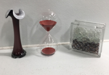 Pink Vase, Red Sand Hour Glass, Glass Rocks In Glass Case