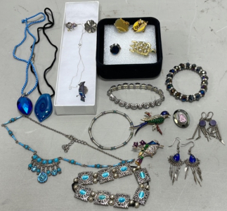 (1) Multicolored Hummingbird Pin, (1) Gold Toned W/ Pearls Turtle Pin, (1) New Orleans Pin, (1) Bear Country Pin, (1) Silver Chain, (3) Bracelets, (3) Necklaces